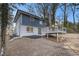 Back of house, featuring a deck and a large backyard at 3506 Crown Point Pl, Decatur, GA 30032