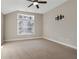 Bright bedroom with carpeted floor, ceiling fan, and large window at 2071 Imperial Pond, Powder Springs, GA 30127