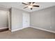 Spacious bedroom with ceiling fan, double door closet, and neutral carpeting at 2071 Imperial Pond, Powder Springs, GA 30127