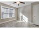 Well-lit bedroom with ceiling fan, large window, and tile flooring at 2071 Imperial Pond, Powder Springs, GA 30127