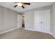 Well-lit bedroom with ceiling fan, double door closet and neutral carpet at 2071 Imperial Pond, Powder Springs, GA 30127