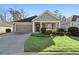 Gray siding two-car garage charming craftsman style home at 2071 Imperial Pond, Powder Springs, GA 30127