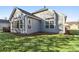 Gray siding, large windows, and a grassy yard at 2071 Imperial Pond, Powder Springs, GA 30127