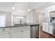 Kitchen island with granite countertop and stainless steel dishwasher at 2071 Imperial Pond, Powder Springs, GA 30127