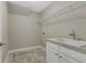 Laundry room with utility sink and shelving at 2071 Imperial Pond, Powder Springs, GA 30127