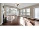 Spacious living room featuring hardwood floors, fireplace and sunroom at 2071 Imperial Pond, Powder Springs, GA 30127