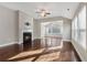 Living room with hardwood floors, fireplace and sunroom access at 2071 Imperial Pond, Powder Springs, GA 30127