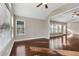 Open living room with hardwood floors and views into adjacent sunroom and kitchen at 2071 Imperial Pond, Powder Springs, GA 30127