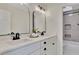 Modern bathroom with double vanity, black matte fixtures, and arched mirrors at 3405 Doral Ln, Woodstock, GA 30189