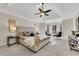 Bright primary bedroom featuring a large window and seating area at 3405 Doral Ln, Woodstock, GA 30189