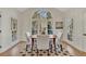 Casual breakfast nook with round table and access to the kitchen at 3405 Doral Ln, Woodstock, GA 30189