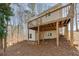 House exterior with deck and wooded setting at 3405 Doral Ln, Woodstock, GA 30189