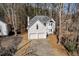 Two-story house with attached two-car garage at 3405 Doral Ln, Woodstock, GA 30189