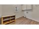 Laundry room with wood shelving and vinyl flooring at 3405 Doral Ln, Woodstock, GA 30189