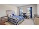 Cozy bedroom with a double bed and plenty of natural light at 4200 Oxcliffe Grv, Suwanee, GA 30024