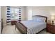 Bright bedroom with a double bed and blue and white striped bedding at 4200 Oxcliffe Grv, Suwanee, GA 30024