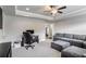 Spacious bonus room with seating area and built-in workspace at 4200 Oxcliffe Grv, Suwanee, GA 30024