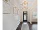 Bright entryway with dark hardwood floors and wall art at 6285 Vista Crossing Way, Cumming, GA 30028