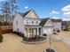 Gray siding two-story home with a landscaped front yard and driveway at 6285 Vista Crossing Way, Cumming, GA 30028