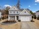 Two-story house with gray siding, white trim, and a landscaped yard at 6285 Vista Crossing Way, Cumming, GA 30028