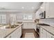 Modern kitchen with white cabinets, granite countertops, and stainless steel appliances at 6285 Vista Crossing Way, Cumming, GA 30028