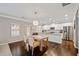 Modern kitchen with white cabinets, granite countertops, and stainless steel appliances at 6285 Vista Crossing Way, Cumming, GA 30028