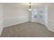 Dining room with bay window, neutral wall paint, and carpet flooring at 169 Hunters, Mcdonough, GA 30253