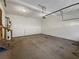 Attached garage with high ceilings and concrete floor at 169 Hunters, Mcdonough, GA 30253