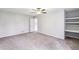 Bright bedroom with carpet, ceiling fan and built-in shelving at 275 Shaded Oaks Se Ln, Marietta, GA 30067