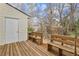 Wooden deck with storage shed and benches, overlooking a wooded area at 275 Shaded Oaks Se Ln, Marietta, GA 30067