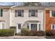 Updated 2-story townhome with neutral siding and landscaping at 275 Shaded Oaks Se Ln, Marietta, GA 30067