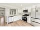 Modern kitchen with white shaker cabinets and stainless steel appliances at 275 Shaded Oaks Se Ln, Marietta, GA 30067