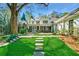 Large backyard with stone patio and steps leading to the house at 3382 Habersham Nw Rd, Atlanta, GA 30305