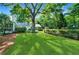 Large backyard with lush lawn and mature trees at 3382 Habersham Nw Rd, Atlanta, GA 30305