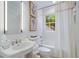 Clean bathroom with a pedestal sink, white subway tiles, and a shower/tub combo at 3382 Habersham Nw Rd, Atlanta, GA 30305