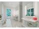 Spa-like bathroom featuring a soaking tub, double vanity, and marble flooring at 3382 Habersham Nw Rd, Atlanta, GA 30305