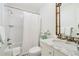 Clean bathroom with white subway tiles, marble vanity and bamboo mirror at 3382 Habersham Nw Rd, Atlanta, GA 30305