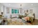 Spacious bedroom with twin beds, hardwood floors, and a charming chandelier at 3382 Habersham Nw Rd, Atlanta, GA 30305