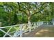 Deck with white railing offering scenic treetop views at 3382 Habersham Rd, Atlanta, GA 30305