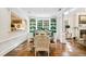 Elegant dining room, green built-ins, hardwood floors at 3382 Habersham Rd, Atlanta, GA 30305