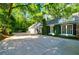 House exterior with attached garage and ivy-covered walls at 3382 Habersham Nw Rd, Atlanta, GA 30305