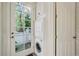 Stackable washer and dryer in a well-lit laundry room with exterior access at 3382 Habersham Rd, Atlanta, GA 30305