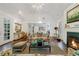 Bright living room with hardwood floors, fireplace, and high ceilings at 3382 Habersham Nw Rd, Atlanta, GA 30305