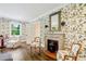 Sitting room with ornate fireplace, hardwood floors and French chairs at 3382 Habersham Nw Rd, Atlanta, GA 30305