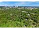 Expansive aerial view showcasing the home's proximity to the city skyline amidst lush, green surroundings at 3382 Habersham Rd, Atlanta, GA 30305