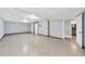 Spacious basement area featuring tile flooring, neutral paint, and an open door to a bathroom at 3505 Watson Rd, Cumming, GA 30028