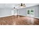 Finished basement with hardwood floors, ceiling fans, glass doors and a standard door at 3505 Watson Rd, Cumming, GA 30028