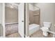 Bathroom featuring a tub, tiled floors, and view into the bedroom at 3505 Watson Rd, Cumming, GA 30028