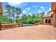 Spacious wooden deck overlooking the pool and lush greenery, ideal for relaxation and outdoor living at 3505 Watson Rd, Cumming, GA 30028