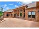 Large wooden deck provides an outdoor living space with views of the brick home's architecture at 3505 Watson Rd, Cumming, GA 30028